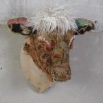 Beauty
:Large Cow Head
Antique Bark Cloth, 
antique needlepoint, Velvet, Faux Fur and Studs
39"H x 27" W x 26"D
20 Lbs.

$3500