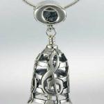 Sterling Silver Music Bell Pendant $85
Music is expressive, graceful, fun, and romantic.  This enchanting bell is crafted with starr lines and floating treble clefts.  Its dancing clapper is an eitght note and the bail is a whole note.  Its lovely jingle will remind you of your love of music.